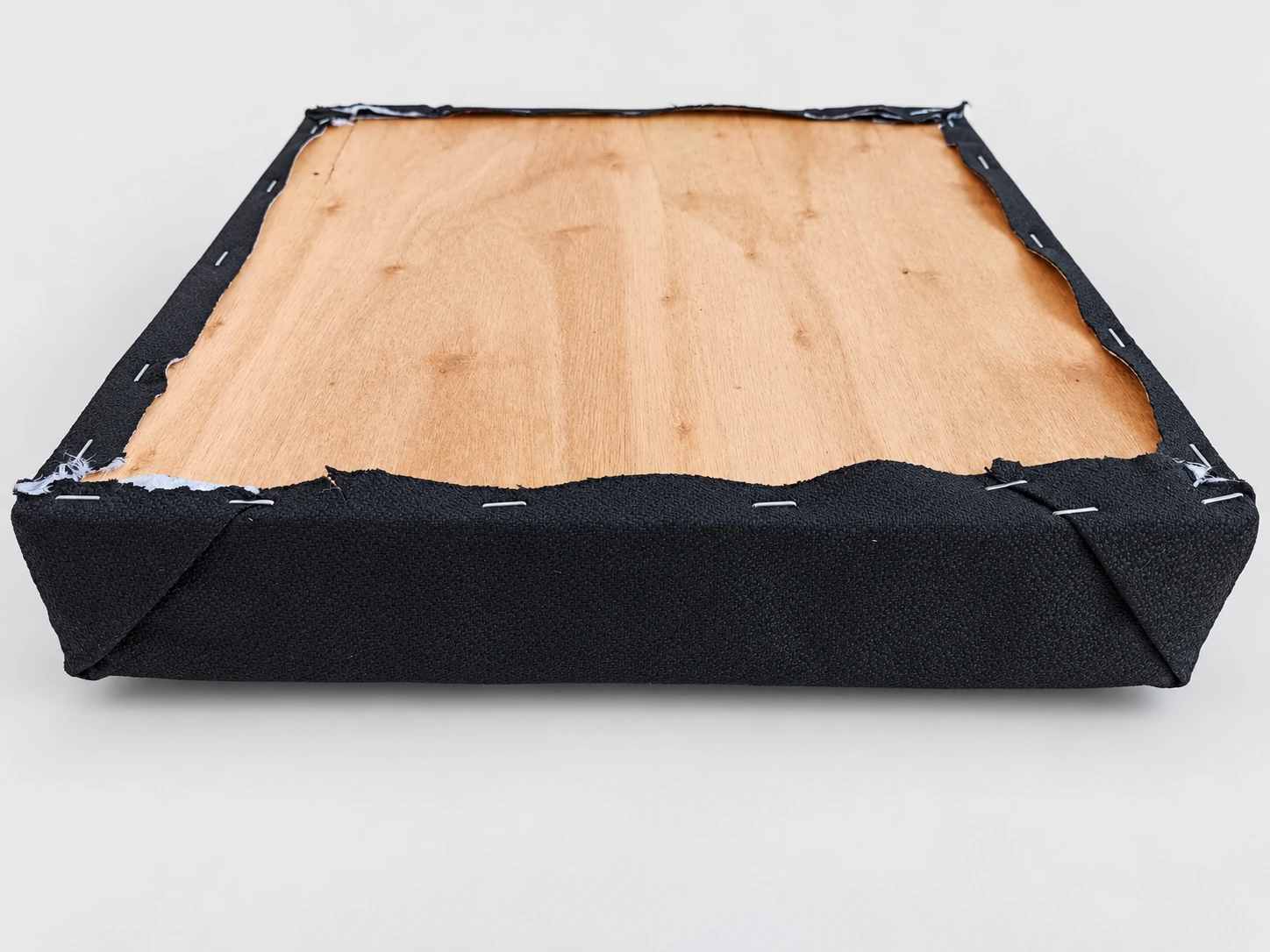 MNQ014 padding panel rear view showing wooden backing, staples and fabric wrap